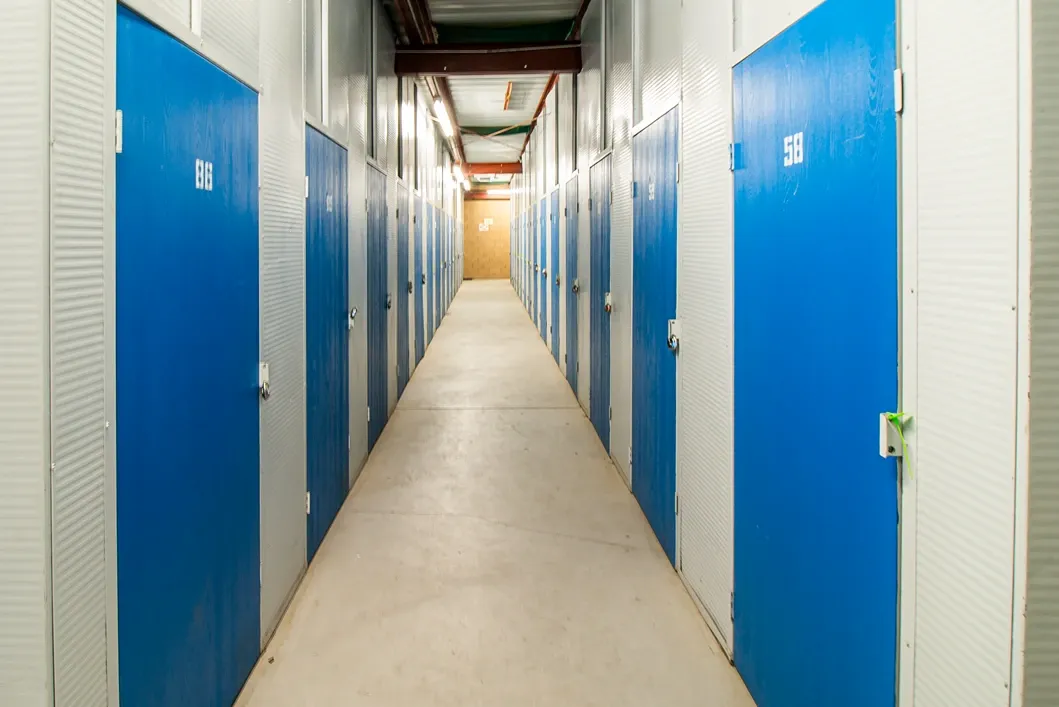 Climate-controlled indoor storage hallway with secure unit doors